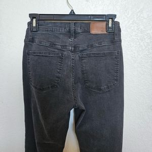 Madewell black high rise jeans with chewed hem. $60 obo